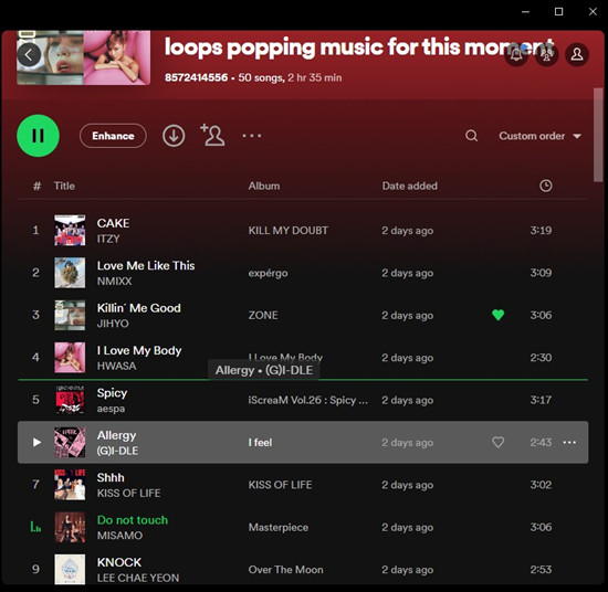 drag and drop a song to change order of songs on Spotify playlists